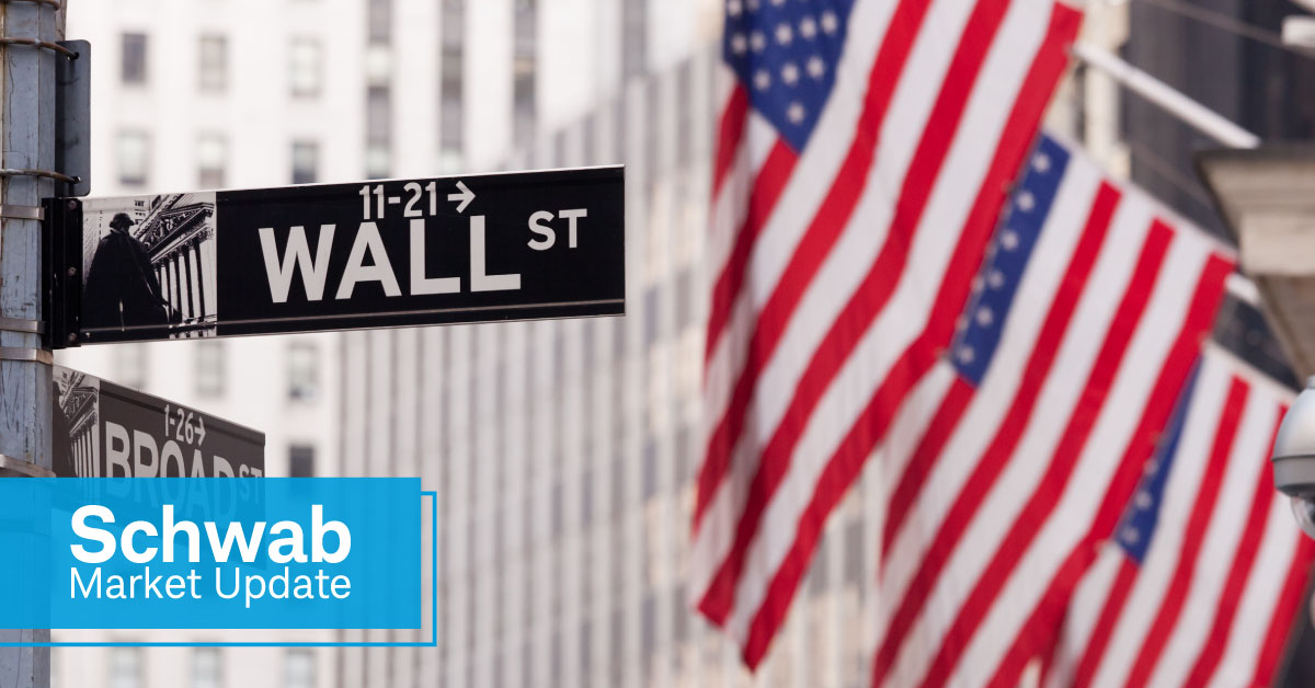 Schwab Market Update: American flags on the corner of Wall Street and Broad Street. 