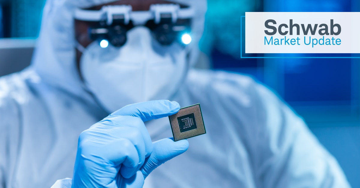 Schwab Market Update: A worker in a microprocessor lab.