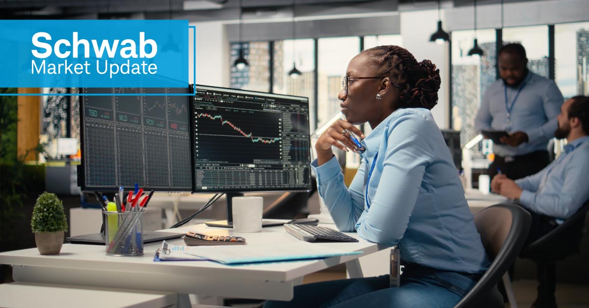Schwab Market Update: A looking at stock charts on a computer monitors.