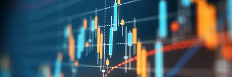 Close-up image of a financial chart displaying candlestick and line graphs.